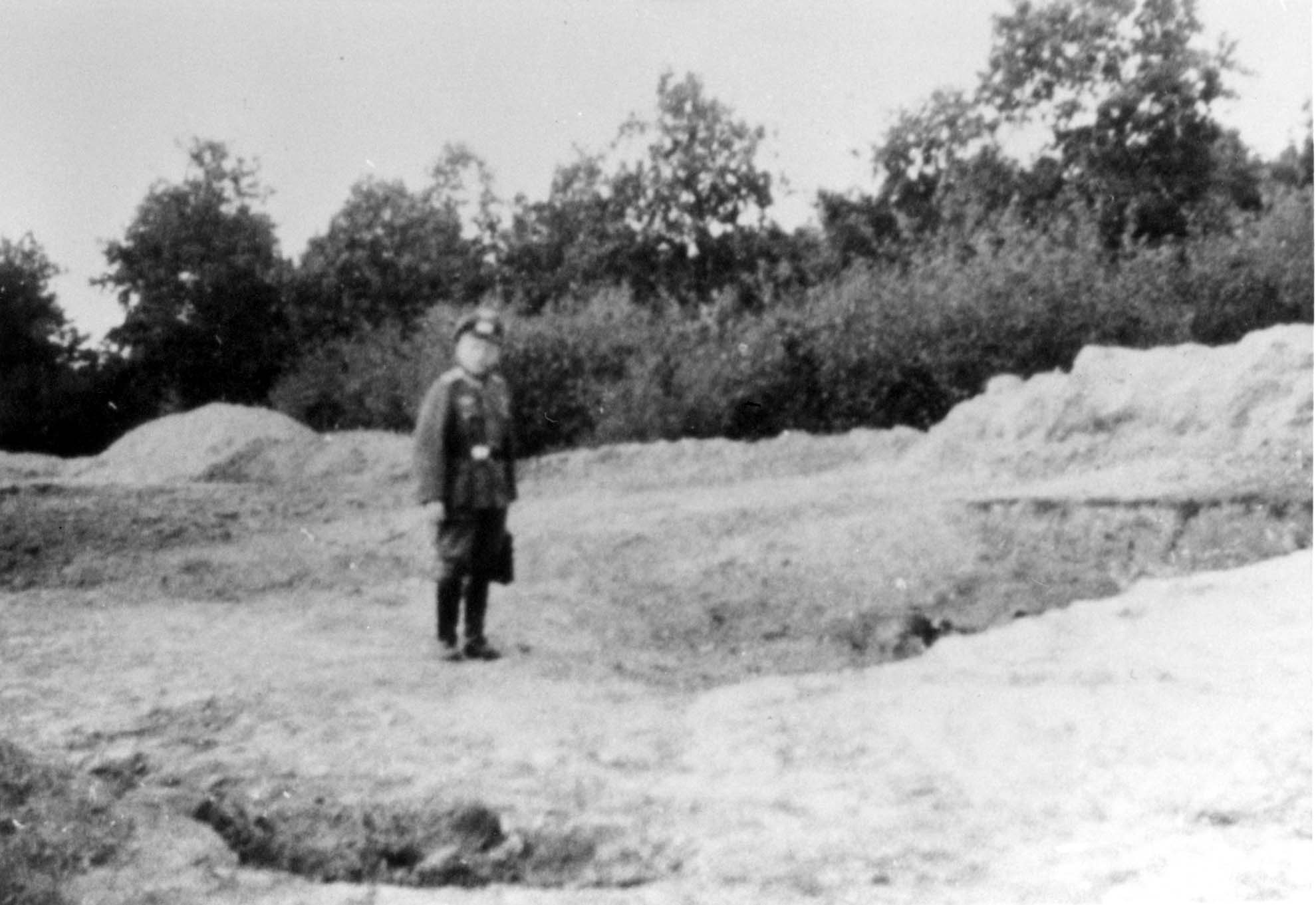 Apparently a member of the German Order Police near the mass grave at Gurka Polonka  Photograph taken shortly after the murder operation